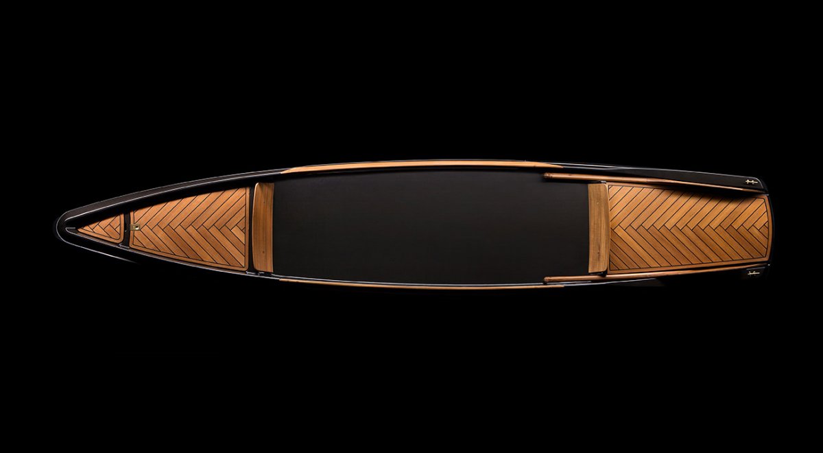 luxury canoe made from carbon fiber and teak wood